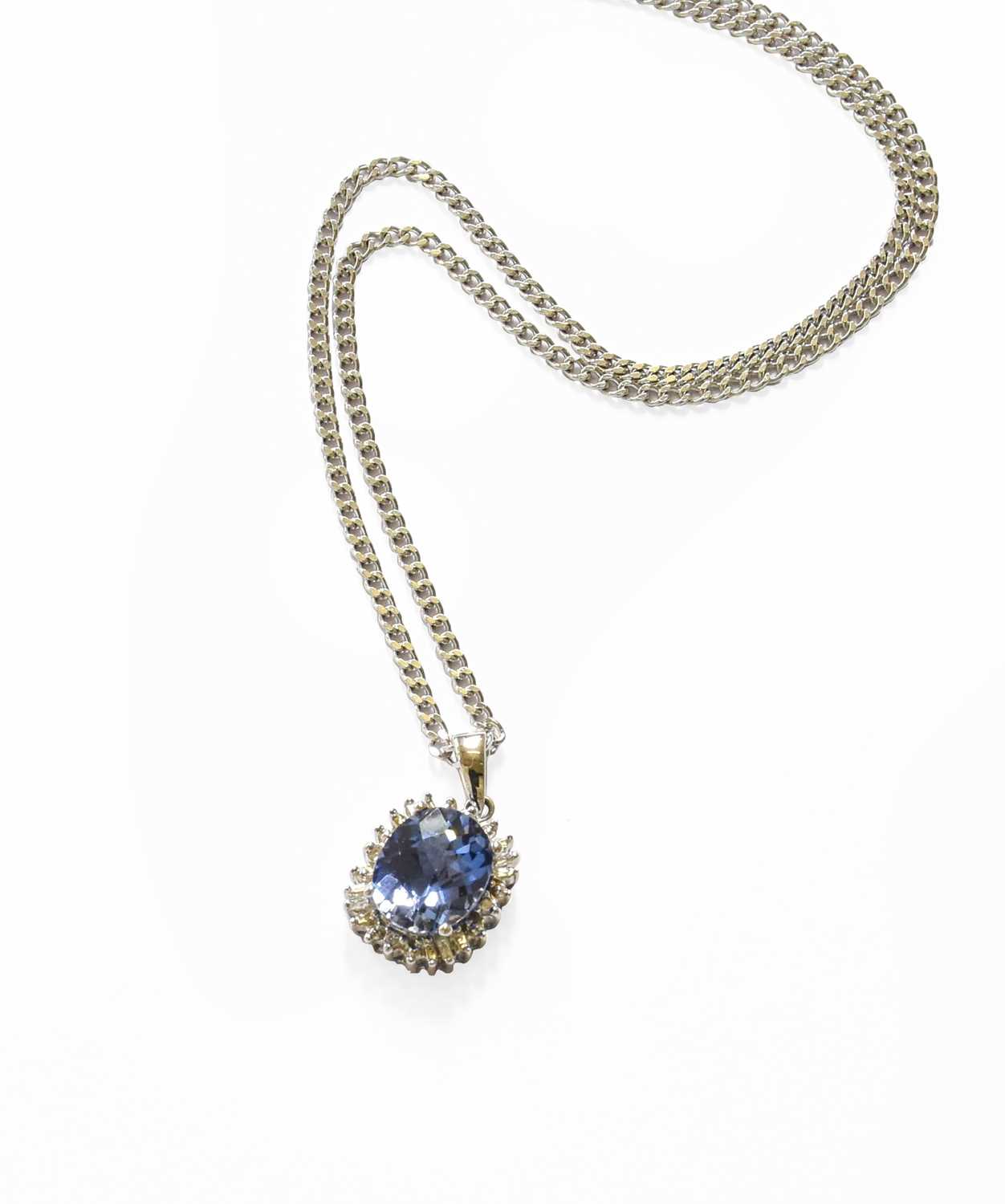 Lot 241 - A Synthetic Sapphire and Diamond Pendant on...