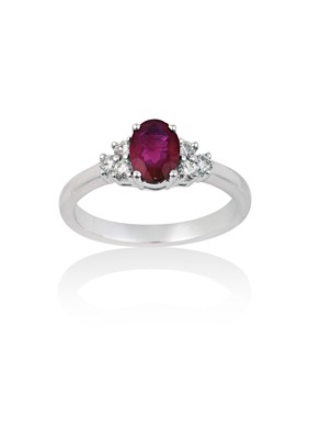 Lot 2057 - An 18 Carat White Gold Synthetic Ruby and...