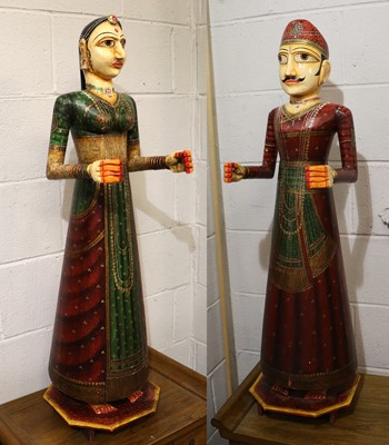 Lot 1100 - A Pair of Indian Polychrome Wood Statues of...