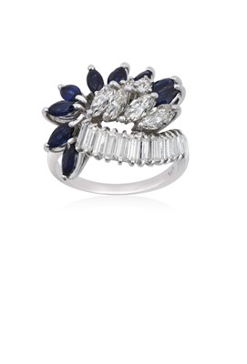 Lot 2228 - A Sapphire and Diamond Cluster Ring a row of...