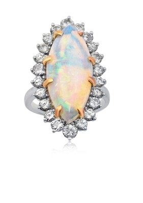 Lot 2257 - An Opal and Diamond Cluster Ring the oval...