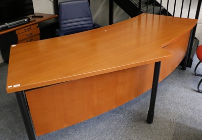 Lot 1119 - Neudorfler: A Cherrywood Curved Desk, on...