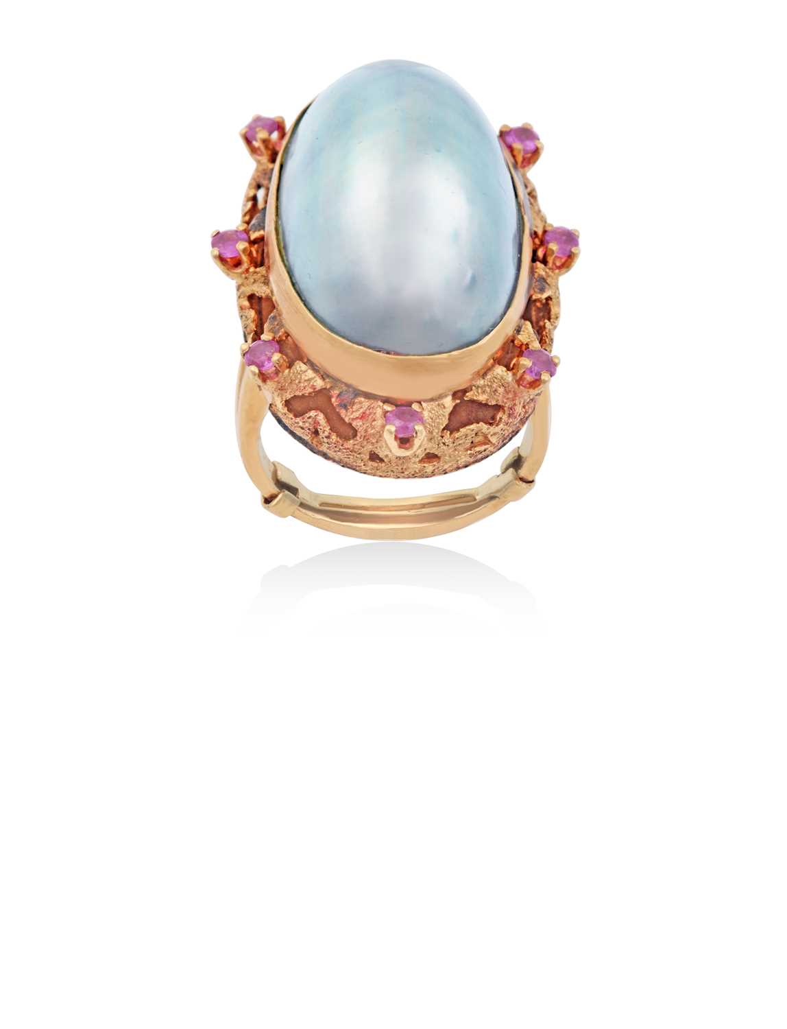 Lot 2121 - A Mother-of-Pearl and Synthetic Ruby Cluster...