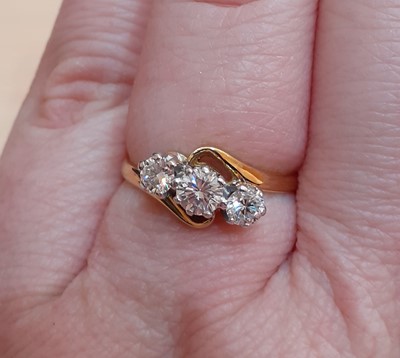 Lot 2156 - An 18 Carat Gold Diamond Three Stone Twist...