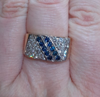 Lot 2020 - A Sapphire and Diamond Ring two rows of round...