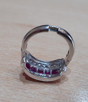 Lot 2059 - A Ruby and Diamond Ring five calibré cut...