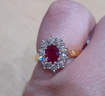 Lot 2035 - An 18 Carat Gold Ruby and Diamond Cluster Ring...