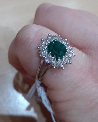 Lot 2092 - An Emerald and Diamond Cluster Ring the...