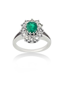Lot 2092 - An Emerald and Diamond Cluster Ring the...