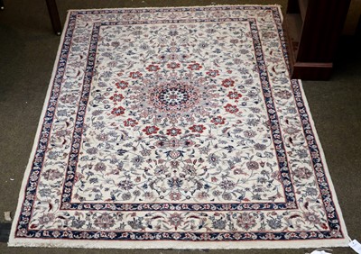 Lot 1015 - An Indian Rug, the ivory field of vines around...