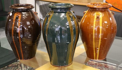 Lot 368 - Three Modern Glazed Terracotta Olive Jars,...