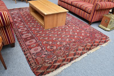 Lot 1020 - A Tekke Carpet, the brick red field with...