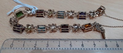 Lot 2129 - A Multi-Gem Set Bracelet the emerald-cut...