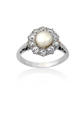 Lot 2154 - A Pearl and Diamond Cluster Ring the pearl...