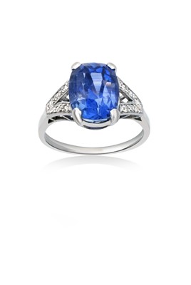 Lot 2223 - A Sapphire and Diamond Ring the cushion cut...