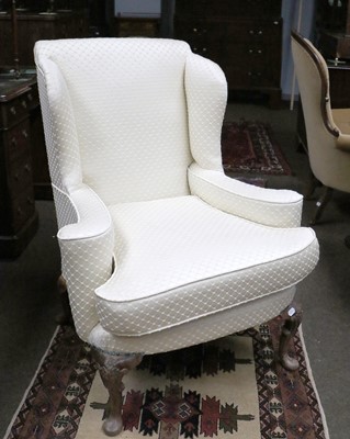 Lot 1180 - A George III Style Wing Back Chair, upholsterd...