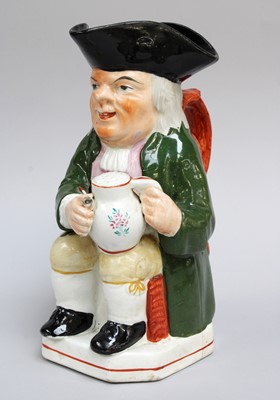 Lot 326 - A 19th Century Pearlware Toby Jug, of Wood...