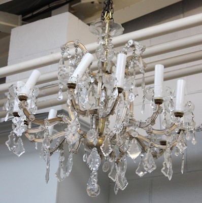 Lot 1194 - A Glass Twelve Light Chandelier, the scrolling...