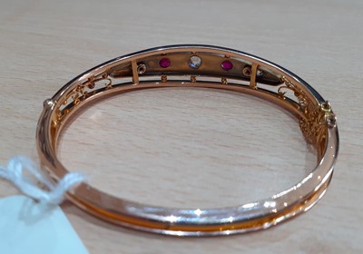 Lot 2127 - A Ruby and Diamond Bangle the central tapered...