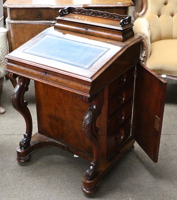 Lot 1183 - A Victorian Figured Walnut Davenport, with...