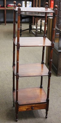 Lot 1232 - A Regency Mahogany Four Tier Whatnot, on ring...