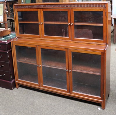 Lot 1216a - A Mahogany Two Tier Triple Bookcase, first...