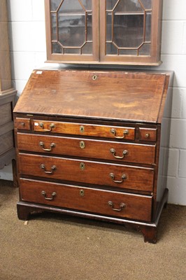 Lot 1227 - A Georgian Mahogany Bureau, crossbanded and...