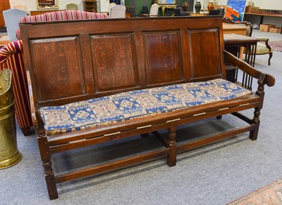 Lot 1141 - An 18th Century Oak Four Panelled Settle,...