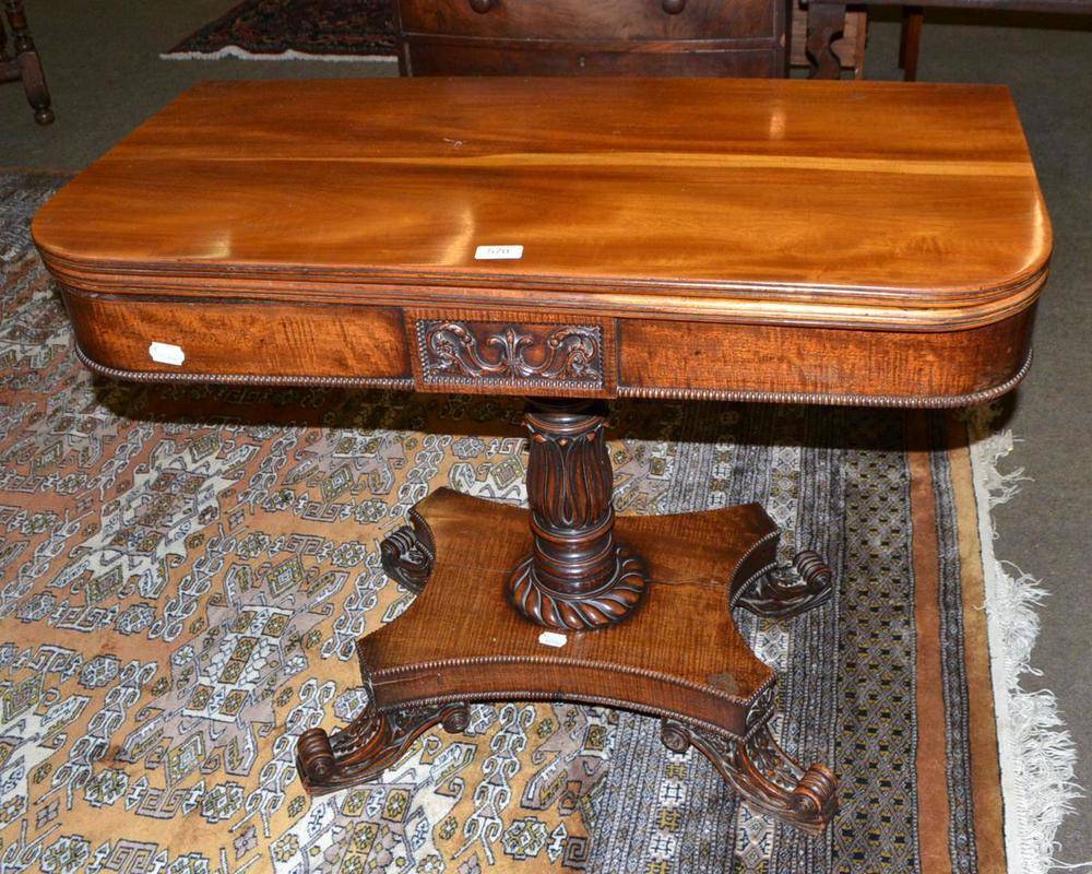 Lot 570 - A William IV Goncalo Alves fold over tea table