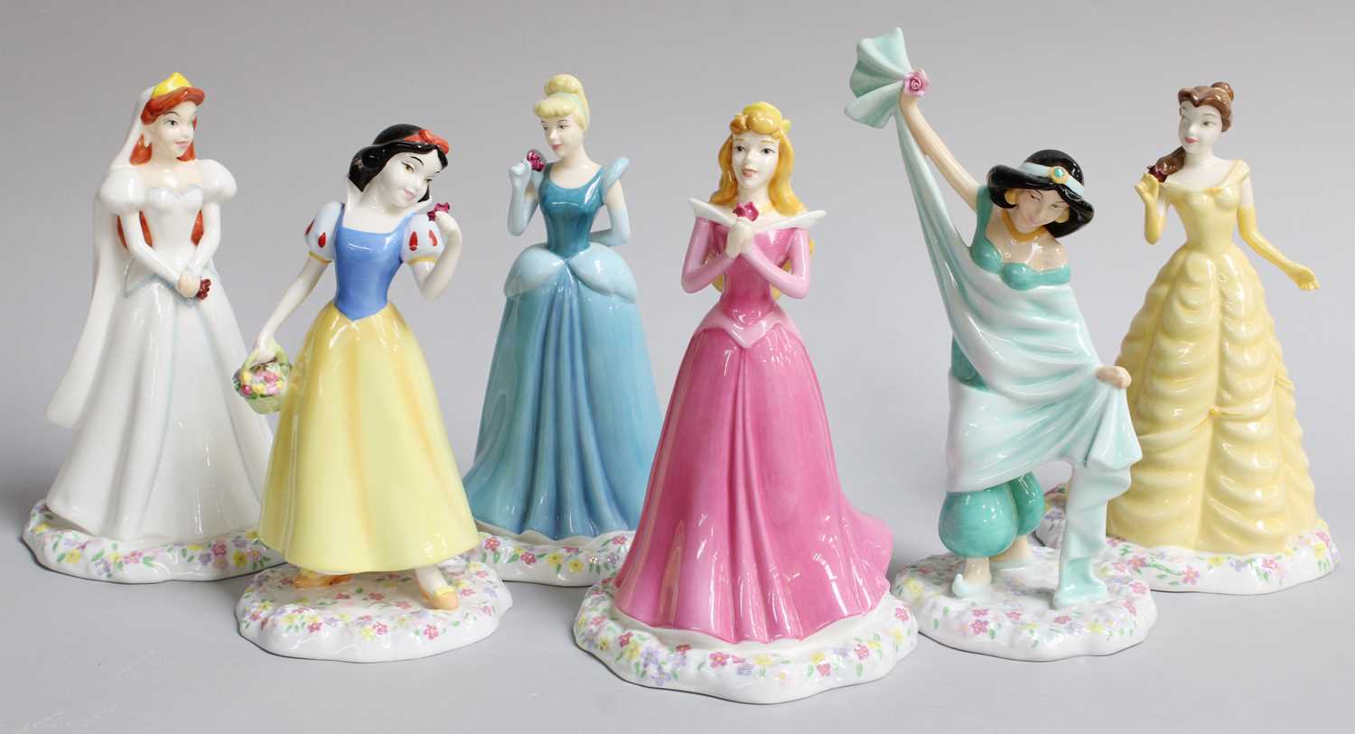 Lot 431 - A Set of Six Royal Doulton Disney Princesses,...