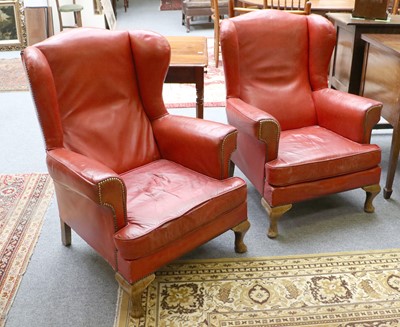 Lot 1155 - A Pair of George III Style Wingback Chairs,...