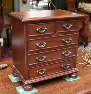 Lot 1167 - A Reproduction Mahogany Miniature Four Height...