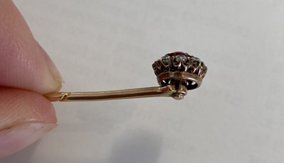 Lot 2173 - A Ruby and Diamond Cluster Stick Pin the...