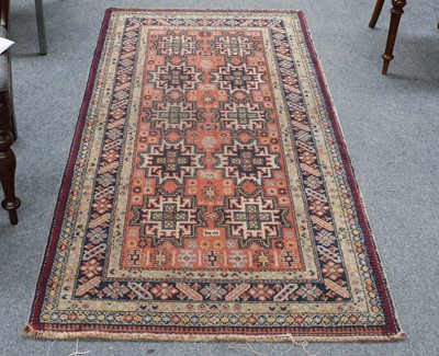 Lot 1096 - A Derbend Rug, a terracotta field with two...