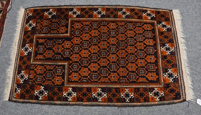 Lot 1033 - A Baluch Prayer Rug, the charcoal lattice...