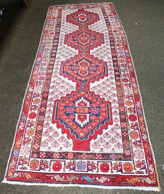 Lot 1029 - A North West Persian Runner, the pale camel...