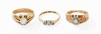 Lot 106 - A Diamond Three Stone Ring, stamped '18CT' and...