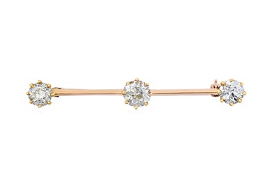 Lot 2279 - A Diamond Three Stone Bar Brooch the old cut...