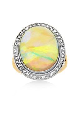 Lot 2288 - An Opal and Diamond Cluster Ring the oval...