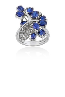 Lot 2143 - A Sapphire and Diamond Ring the spray motif...