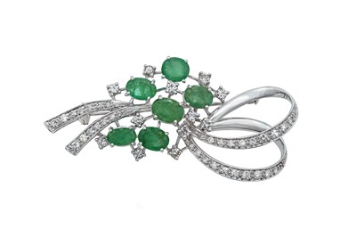 Lot 2102 - An Emerald and Diamond Brooch the ribbon spray...