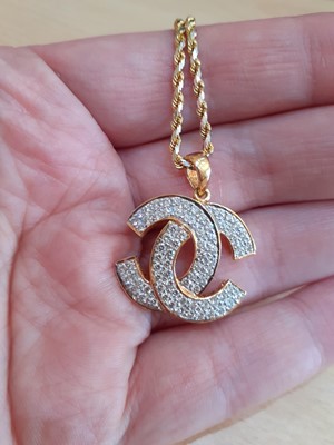 Lot 2142 - A Diamond Pendant on Chain the yellow...