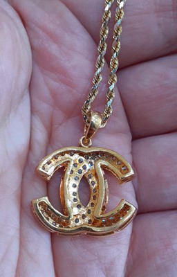 Lot 2142 - A Diamond Pendant on Chain the yellow...