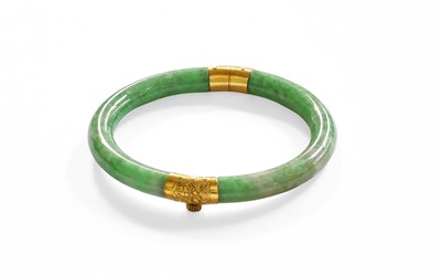 Lot 65 - A Chinese Jadeite Hinged Bangle, the two...