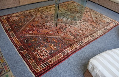 Lot 1200 - A Kashgai Carpet, the faded raspberry field of...