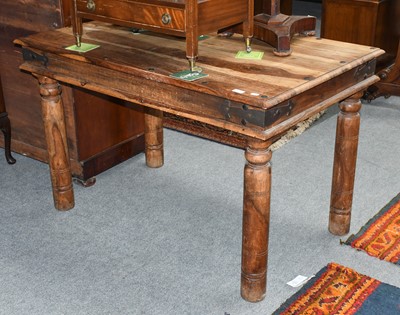 Lot 1226 - A Hardwood Dining Table, with iron mounts and...