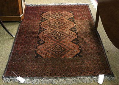 Lot 1024 - An Afghan Rug, the field with four flowerhead...