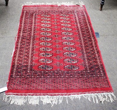 Lot 1017 - An Afghan Turkmen Rug, the claret field with...