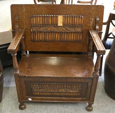 Lot 1135 - A Carved Oak Monks Bench, first half 20th...