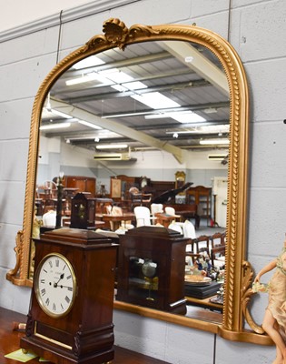 Lot 1200 - A Gilt Framed Oval Mantel Mirror, with shell...